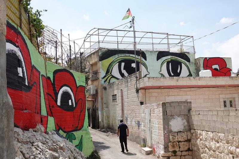 ภาพวาดฝาผนังส่งสารประท้วงในเยรูซาเล็ม