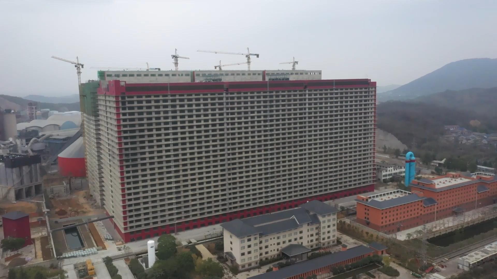 จีนใช้ตึกสูง 26 ชั้น สร้าง 'ฟาร์มหมู' ผลผลิตเกินครึ่งล้านต่อปี